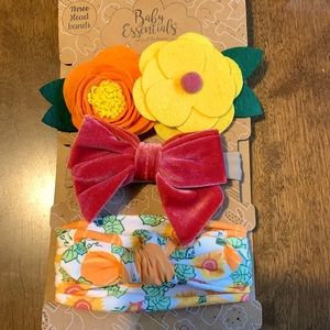 Three 0-24 months headbands.  New with Tags.